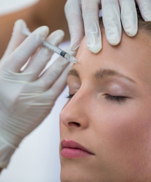 female-patient-receiving-botox-injection-forehead_107420-74099