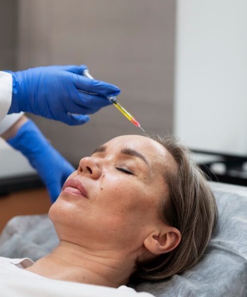 high-angle-woman-getting-prp-treatment_23-2149341418